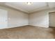 Spacious bedroom with neutral walls and brown carpet at 544 Alderly Dr, Moncks Corner, SC 29461