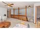 Spacious loft area with high ceilings and wood railings overlooking the main floor at 137 Fox Chase Dr, Goose Creek, SC 29445