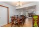 Bright dining room features a wood table with six chairs and access to the living area at 137 Fox Chase Dr, Goose Creek, SC 29445