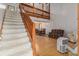 Wooden staircase with carpeted steps leading to an open living area at 137 Fox Chase Dr, Goose Creek, SC 29445