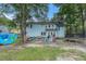 House backyard with trampoline and playset at 137 Fox Chase Dr, Goose Creek, SC 29445