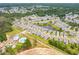 Aerial view of community with pond, pool, and many homes at 1660 Siloh Dr # 472, Mount Pleasant, SC 29466