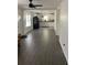 Spacious living area with dark gray vinyl plank flooring and an open concept layout at 110 Groves St, Walterboro, SC 29488