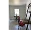 Bright office with tile floors, a writing desk, and a small round table at 110 Groves St, Walterboro, SC 29488