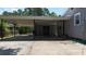 Covered carport provides parking and additional storage area at 110 Groves St, Walterboro, SC 29488