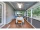 Relaxing screened porch with tiled floor and outdoor seating area at 1213 Westward Dr, Goose Creek, SC 29445