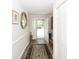 Bright entryway with tile flooring, a decorative rug, and access to the backyard at 103 President Cir, Summerville, SC 29483