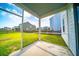 Screened porch overlooking backyard with grassy area at 107 Goose Rd, Summerville, SC 29483