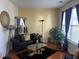 Living room with black leather sofa, glass coffee table, and hardwood floors at 131 Tin Can Aly, Summerville, SC 29483