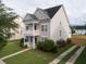 Two-story house with a landscaped yard, driveway, and attached garage at 131 Tin Can Aly, Summerville, SC 29483