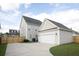 Detached garage with a spacious driveway and wooden fence at 131 Tin Can Aly, Summerville, SC 29483