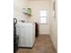 Laundry room with washer, dryer, and shelving at 131 Tin Can Aly, Summerville, SC 29483