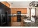 Modern kitchen with black appliances and granite countertops at 131 Tin Can Aly, Summerville, SC 29483