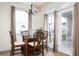 Charming breakfast nook with glass-top table and French doors leading outside at 131 Tin Can Aly, Summerville, SC 29483