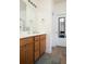 Double vanity bathroom with tile floor and access to a hallway at 131 Tin Can Aly, Summerville, SC 29483