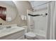 Bathroom with a shower/tub combo, white tile, and a vanity with a large mirror at 512 Whilden St, Mount Pleasant, SC 29464