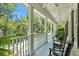 Spacious front porch with white columns and rocking chairs at 512 Whilden St, Mount Pleasant, SC 29464