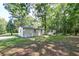 Mobile home exterior view, surrounded by lush trees at 121 Paisan Rd, Summerville, SC 29483