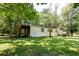 Single-wide mobile home on a grassy lot with mature trees at 121 Paisan Rd, Summerville, SC 29483