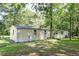 Tan mobile home exterior with a large yard at 121 Paisan Rd, Summerville, SC 29483