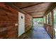 Wooden porch with white door and surrounding trees at 121 Paisan Rd, Summerville, SC 29483
