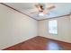 Bright bedroom with a window, ceiling fan, and wood flooring at 121 Paisan Rd, Summerville, SC 29483
