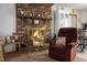 Brick fireplace with a fire burning at 2363 Ranger Dr, Cross, SC 29436