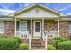 Brick home with front porch and white railing at 2363 Ranger Dr, Cross, SC 29436