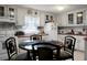 Bright eat-in kitchen with ample cabinetry and a table for four at 2363 Ranger Dr, Cross, SC 29436