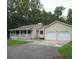 Ranch-style home with two-car garage and porch at 302 Summerset Ln, Summerville, SC 29483