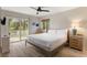 Guest bedroom with a queen-size bed and sliding door access to the deck at 2963 Deer Point Dr, Seabrook Island, SC 29455