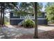 Dark blue home with white trim, stairs and landscaping at 2963 Deer Point Dr, Seabrook Island, SC 29455