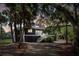 Dark gray house with white stairs and landscaping at 2963 Deer Point Dr, Seabrook Island, SC 29455