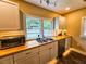 Updated kitchen featuring a double sink and stainless steel appliances at 212 Hickory St, Walterboro, SC 29488