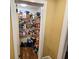 Walk-in pantry with ample shelving for storage at 212 Hickory St, Walterboro, SC 29488