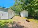 View of the backyard, featuring a shed, and a fire pit at 212 Hickory St, Walterboro, SC 29488
