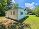 View of the house exterior, showcasing a large yard at 212 Hickory St, Walterboro, SC 29488