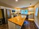 Modern kitchen with stainless steel appliances and butcher block island at 212 Hickory St, Walterboro, SC 29488