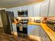 Modern kitchen featuring stainless steel appliances and wood countertops at 212 Hickory St, Walterboro, SC 29488