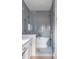Bathroom with grey tile, a soaking tub, and a walk-in shower at 3025 Southerly Way, Johns Island, SC 29455