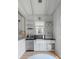 Well-equipped galley kitchen with farmhouse sink and open shelving at 3025 Southerly Way, Johns Island, SC 29455