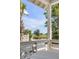 Relaxing porch view overlooking a peaceful waterfront setting with lush greenery at 3025 Southerly Way, Johns Island, SC 29455