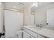 Clean bathroom with a shower/tub combo, white vanity, and quartz countertop at 16 42Nd Ave, Isle of Palms, SC 29451