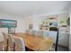 Bright dining room featuring a large wooden table and wicker chairs at 16 42Nd Ave, Isle of Palms, SC 29451