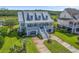 Two-story home with a wraparound porch and landscaped yard at 1374 Black River Dr, Mount Pleasant, SC 29466