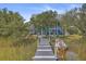 Peaceful waterfront view with a private dock and small boat at 1374 Black River Dr, Mount Pleasant, SC 29466