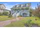 Two-story house with light blue exterior, white trim, and a double garage at 1374 Black River Dr, Mount Pleasant, SC 29466