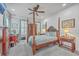 Charming bedroom with wood post bed and plenty of natural light at 1374 Black River Dr, Mount Pleasant, SC 29466