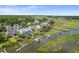 Aerial view of a waterfront community with houses and access to a waterway at 1374 Black River Dr, Mount Pleasant, SC 29466
