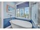 Bathroom featuring a freestanding bathtub and stained glass window at 1374 Black River Dr, Mount Pleasant, SC 29466